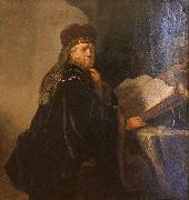 REMBRANDT Harmenszoon van Rijn A Scholar Seated at a Desk china oil painting artist